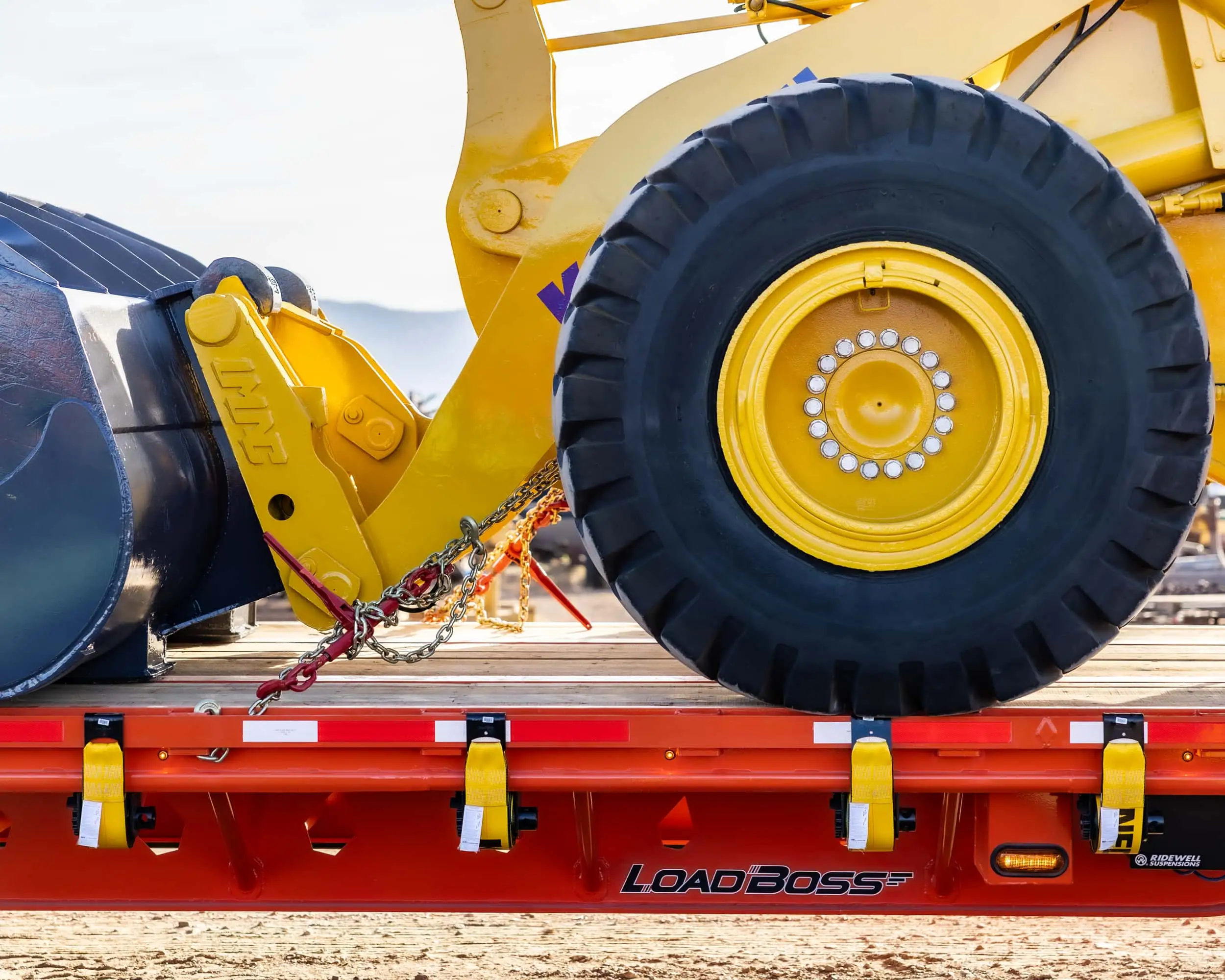 Load Boss Trailer loaded with a construction machine